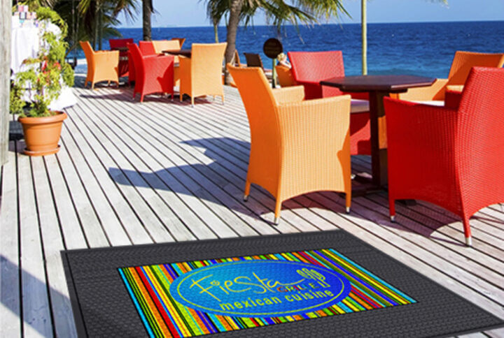 outdoor deck featuring a safety mat with colorful logo