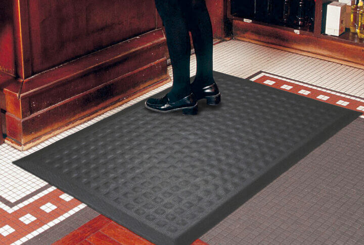 waitress at a bar standing on a Complete-Comfort-IImat