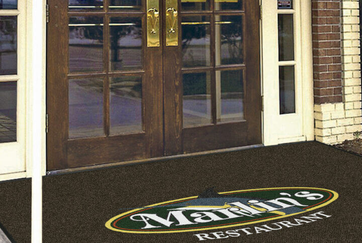 custom logo mat in the entrance of a restaurant